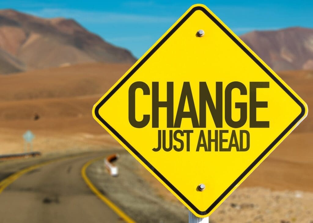 Change is inevitable • Worldly-Minded A road sign reads "change just ahead" as societal awakening is inevitable. We have to accept change to operate at peak performance