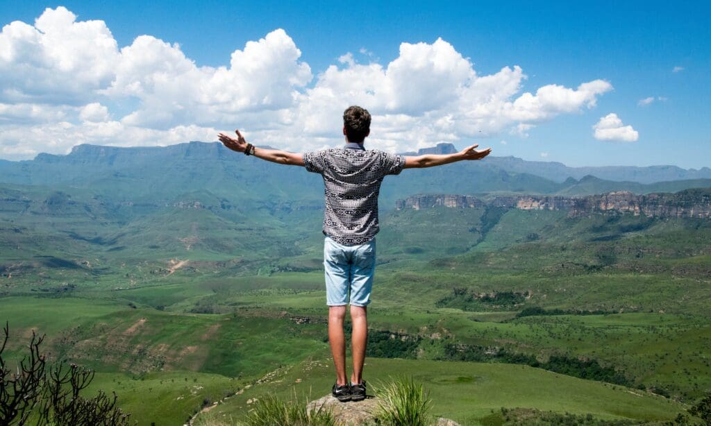 Freedom from alcohol • Worldly-Minded A man stands overlooking a valley with arms outstretched wide. Freedom from alcohol is an incredible feeling